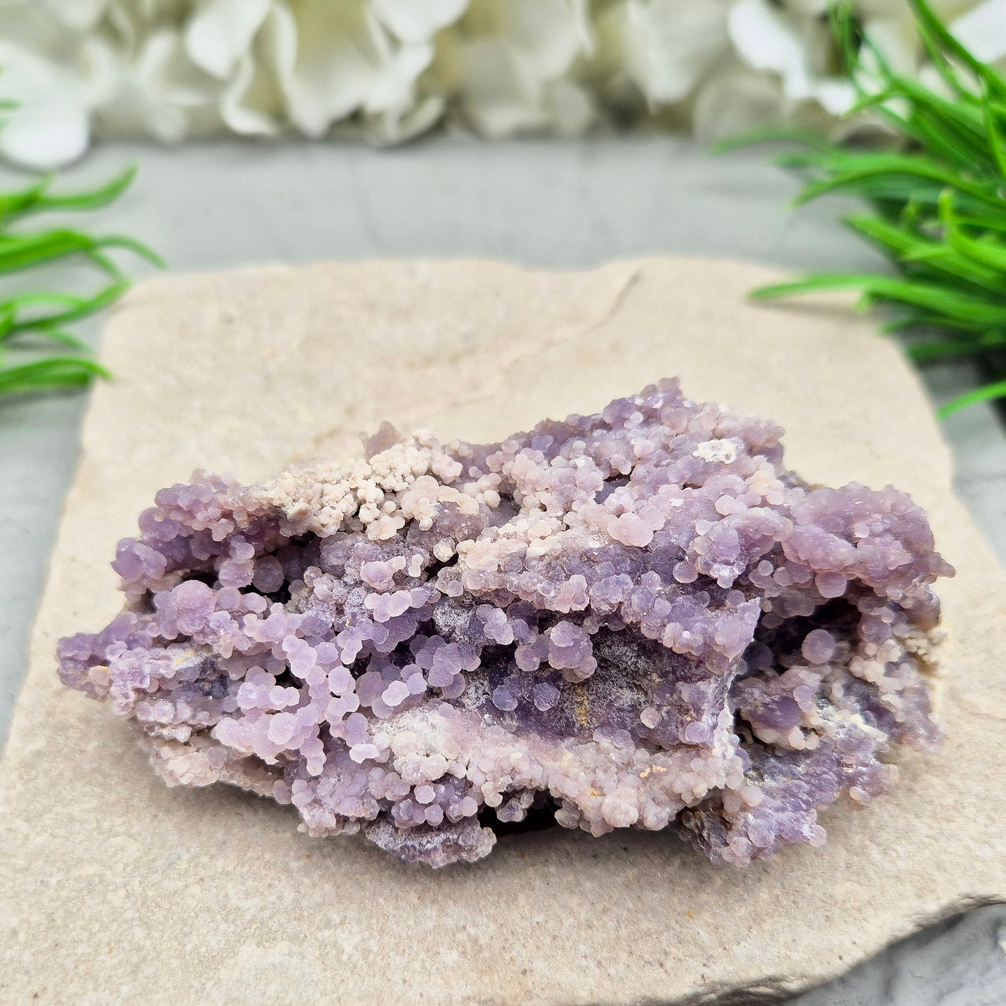This beautiful Grape Agate cluster (also known as Purple Chalcedony or Botryoidal Purple Chalcedony) comes from Indonesia. Its natural ‘grape-like’ formations are made up of tiny rounded crystals that have grown closely together.