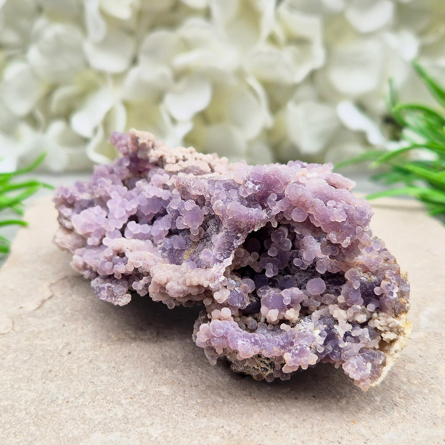 This beautiful Grape Agate cluster (also known as Purple Chalcedony or Botryoidal Purple Chalcedony) comes from Indonesia. Its natural ‘grape-like’ formations are made up of tiny rounded crystals that have grown closely together.