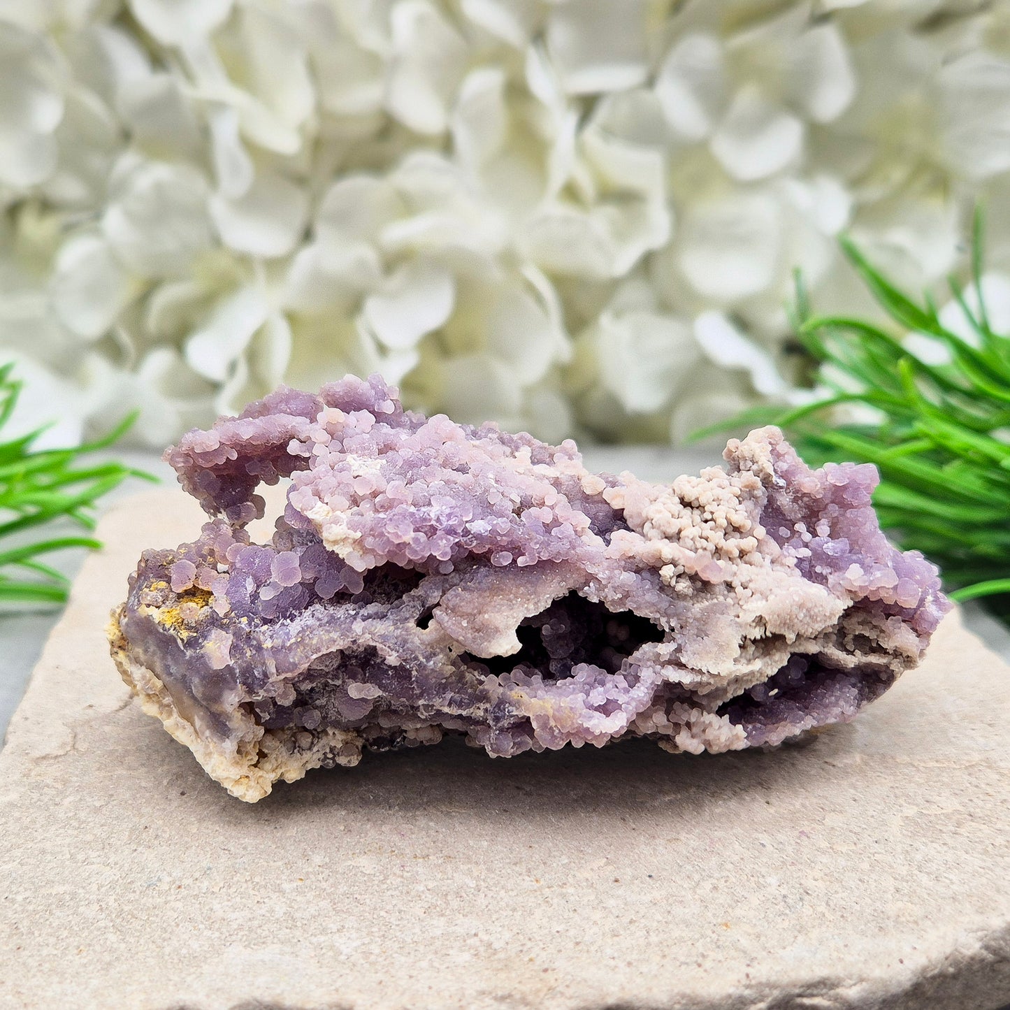 This beautiful Grape Agate cluster (also known as Purple Chalcedony or Botryoidal Purple Chalcedony) comes from Indonesia. Its natural ‘grape-like’ formations are made up of tiny rounded crystals that have grown closely together.