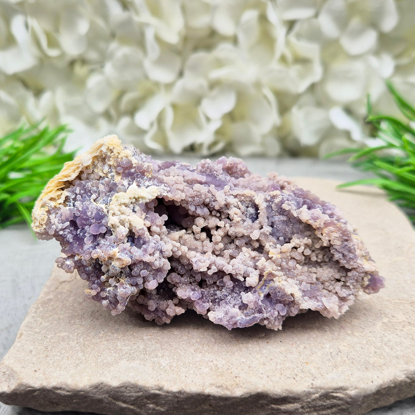 This beautiful Grape Agate cluster (also known as Purple Chalcedony or Botryoidal Purple Chalcedony) comes from Indonesia. Its natural ‘grape-like’ formations are made up of tiny rounded crystals that have grown closely together.