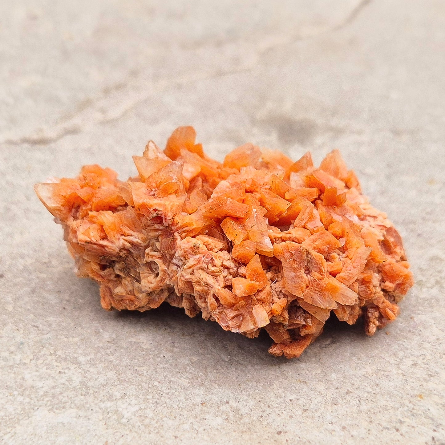 This vibrant Red Heulandite cluster from India showcases naturally formed microcrystalline quartz in rich red tones. Its a supportive crystal for emotional balance, spiritual growth, and intuitive work.