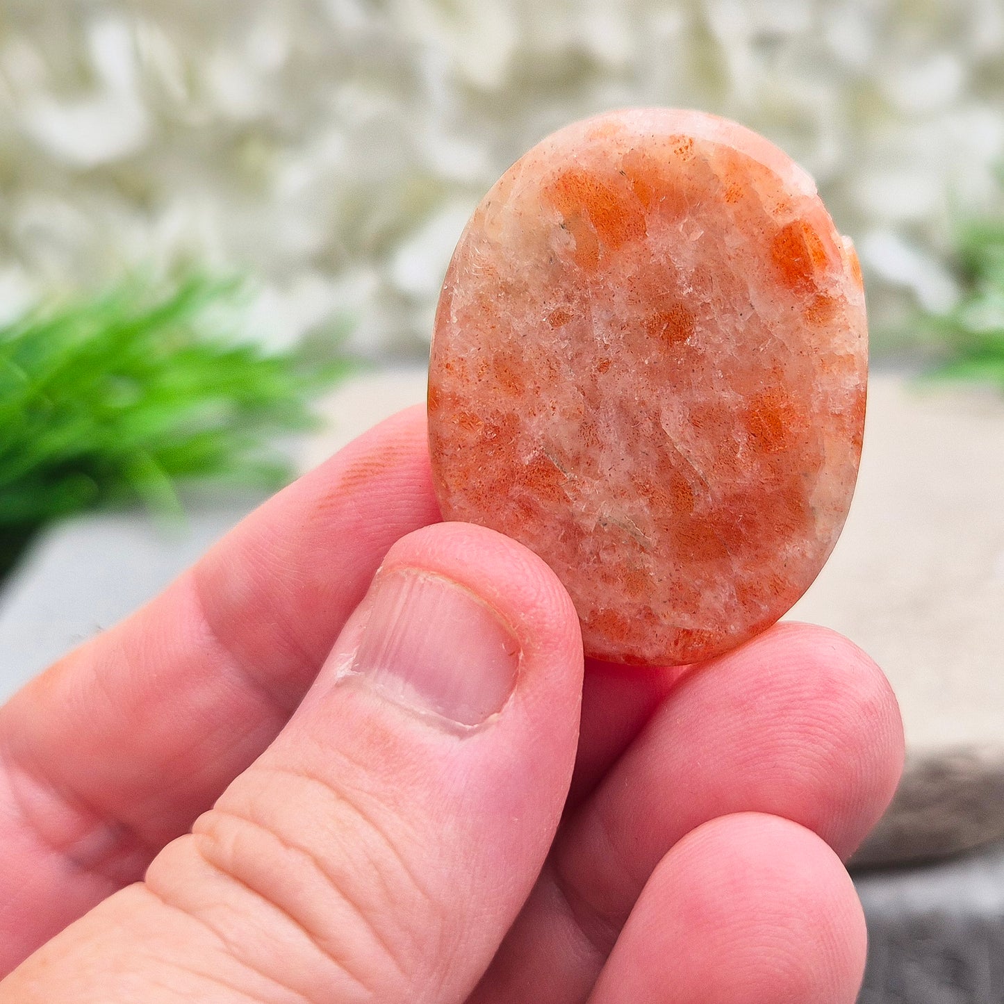 This beautiful flat Sunstone crystal palm stone features warm, peachy-orange tones and a soft, natural shimmer. Sunstone is known for its radiant, positive energy that rekindles your sense of joy, strength, and personal power.