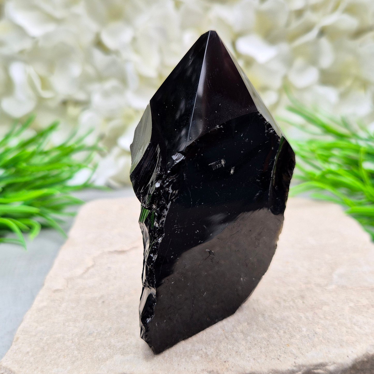 Black Obsidian Standing Point from Mexico. Polished 6 sided generator tip, natural sides and cut base. Its presence encourages clarity and focus, helping you stay centred while connecting with your inner guidance.