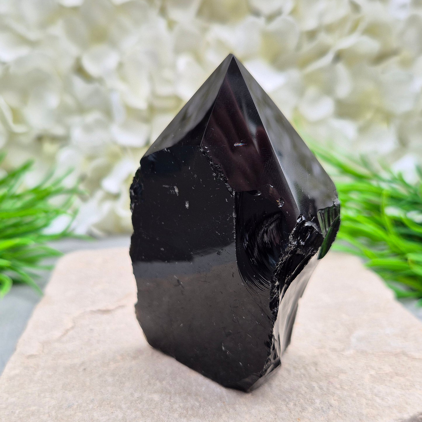 Black Obsidian Standing Point from Mexico. Polished 6 sided generator tip, natural sides and cut base. Its presence encourages clarity and focus, helping you stay centred while connecting with your inner guidance.