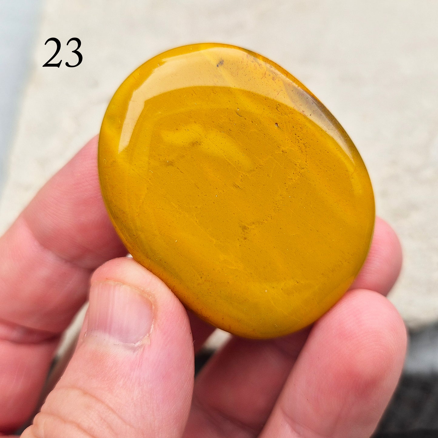 Mookaite Crystal Palm Stone. From the Mooka Creek region in Western Australia, each Mookaite palm stone displays a unique mix of earthy tones—reds, yellows, creams, and purples.