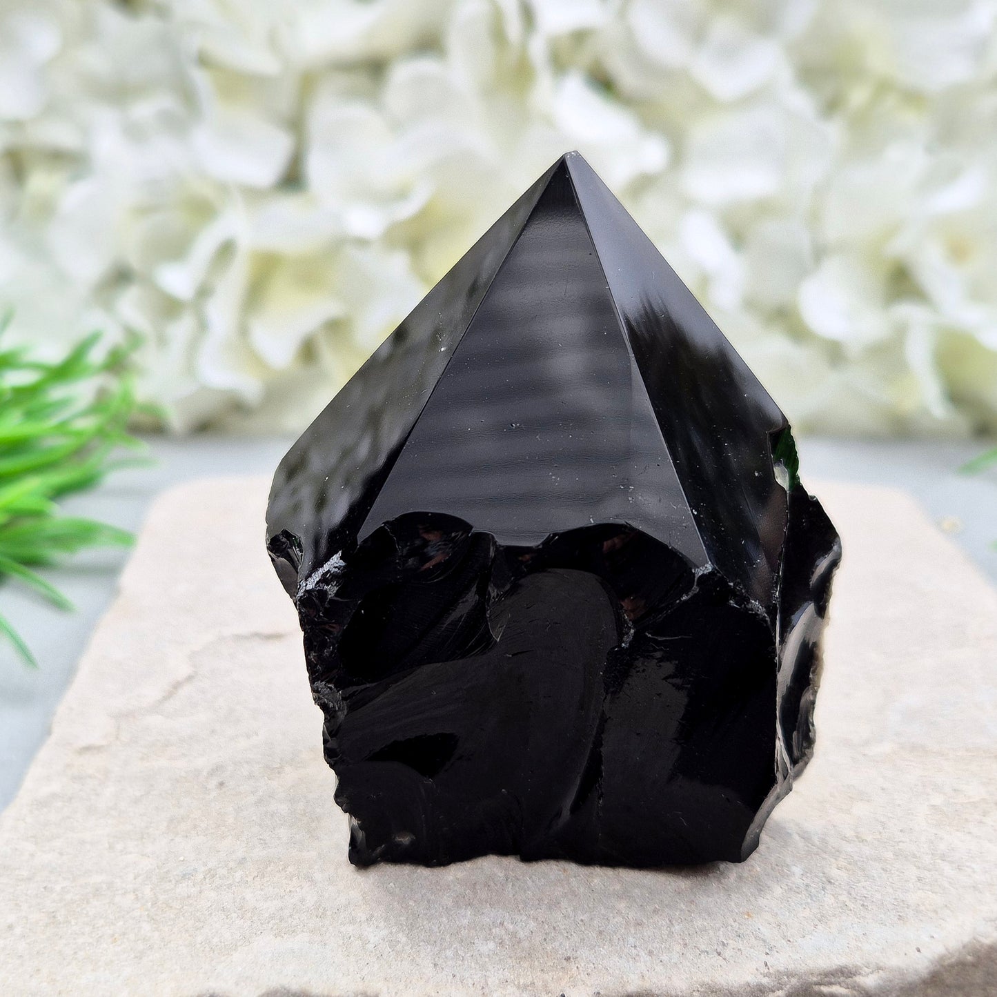 This Black Obsidian standing point comes from Mexico, point is shaped into a six-sided tip with natural sides and a cut base.