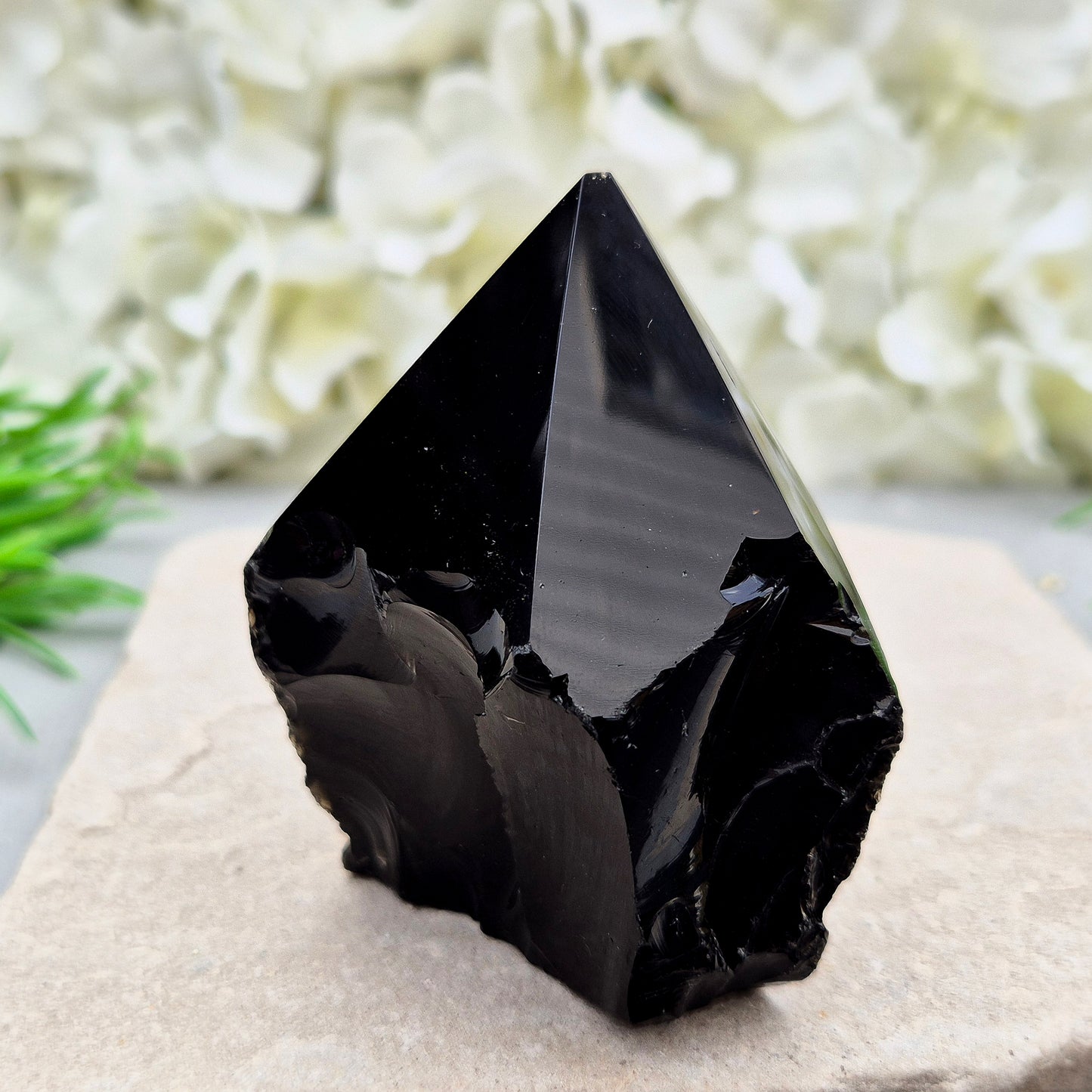 This Black Obsidian standing point comes from Mexico, point is shaped into a six-sided tip with natural sides and a cut base.