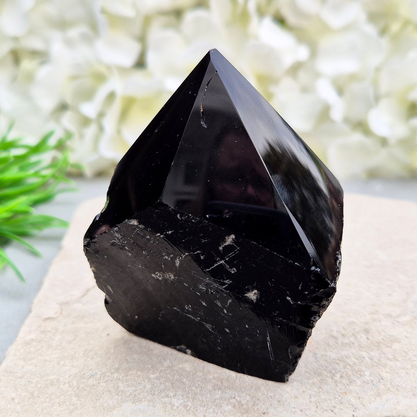 This Black Obsidian standing point comes from Mexico, point is shaped into a six-sided tip with natural sides and a cut base.