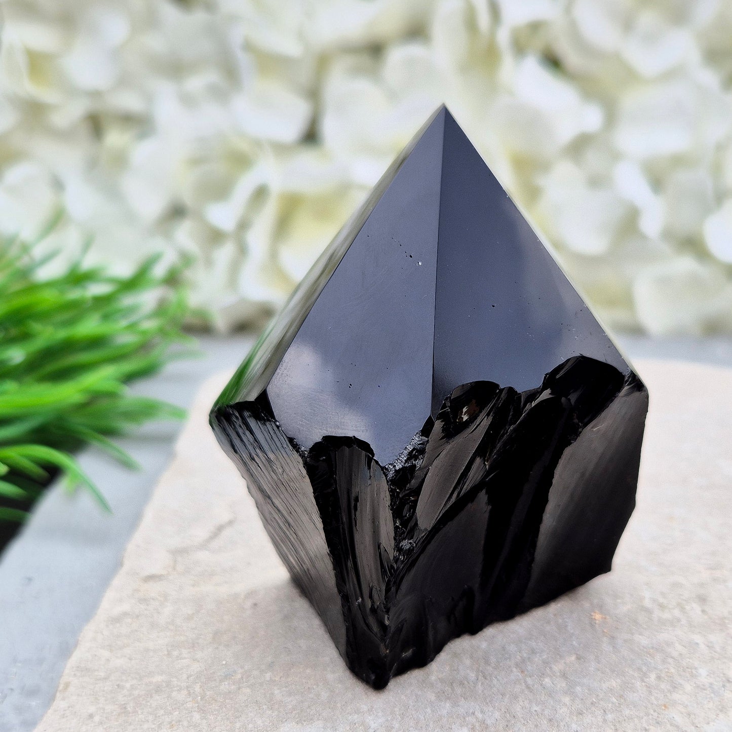This Black Obsidian standing point comes from Mexico, point is shaped into a six-sided tip with natural sides and a cut base.