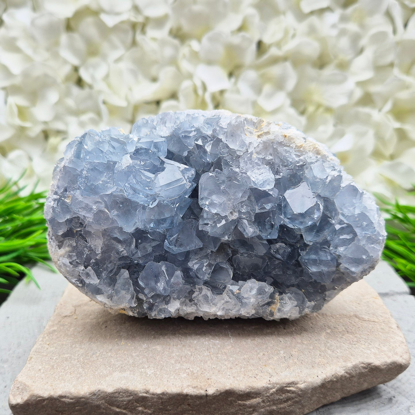 Celestite Crystal Cluster from Madagascar. This beautiful cluster shows sparkling sky-blue crystals on a natural matrix. The base is softly rounded but still sits well on a flat surface.