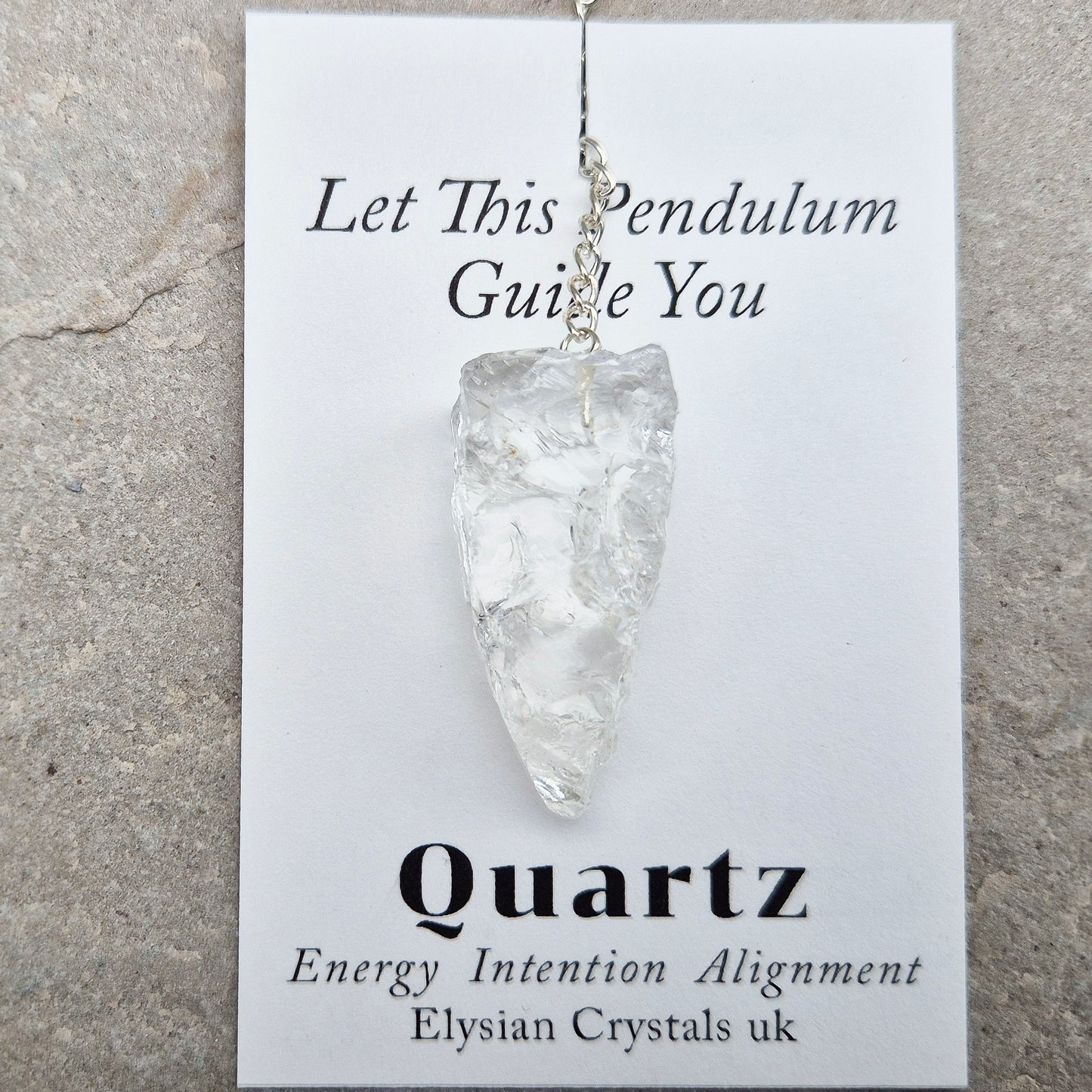 This Rock Quartz Crystal Pendulum from Brazil features a natural quartz crystal and a white bead at the end of the chain. It will come with a card and pouch for safe keeping.