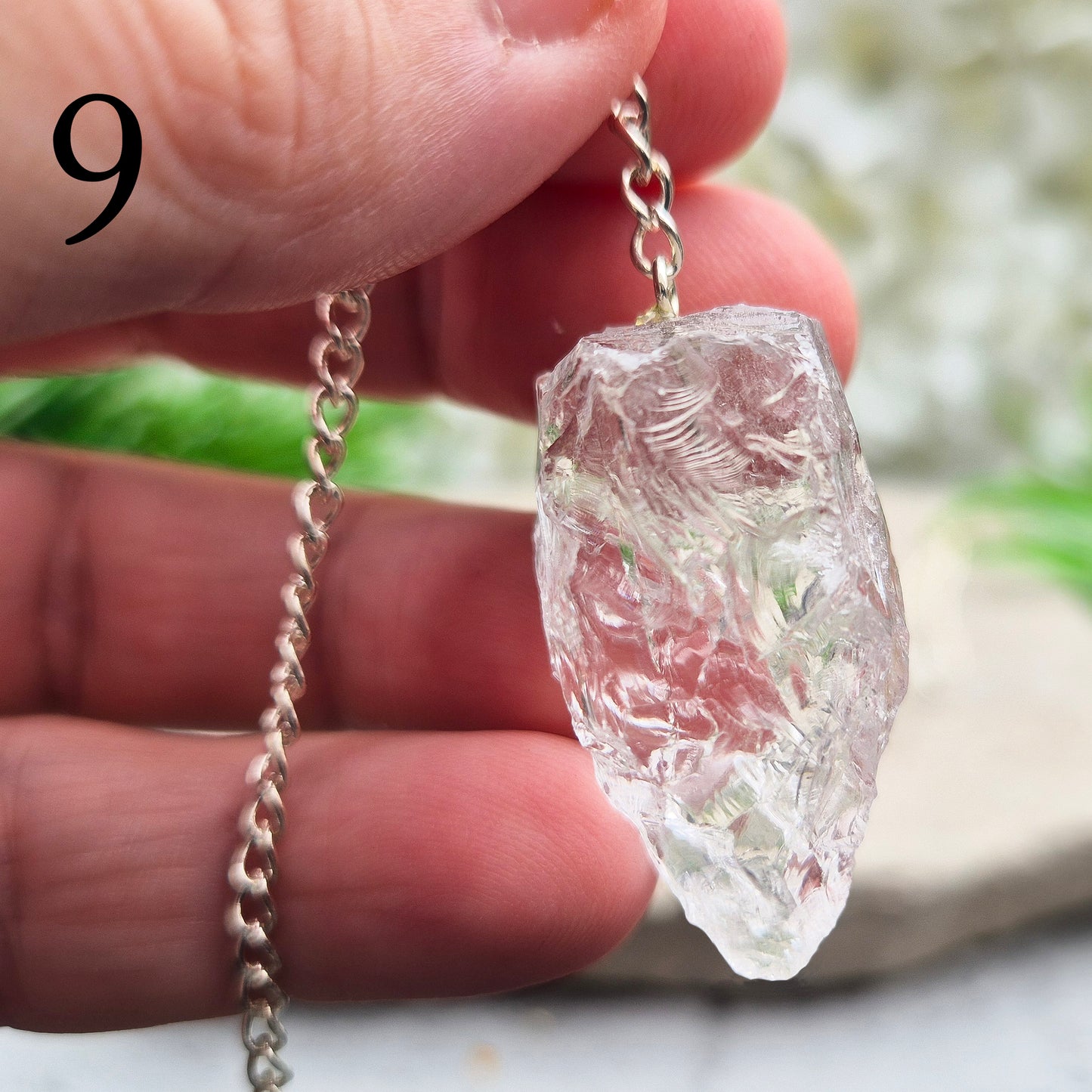 This Rock Quartz Crystal Pendulum from Brazil features a natural quartz crystal and a white bead at the end of the chain. It will come with a card and pouch for safe keeping.