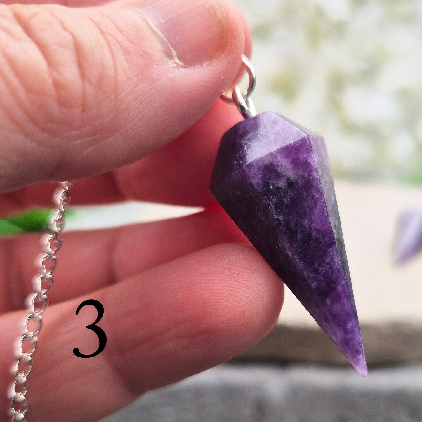 This Lepidolite Crystal Pendulum shows off beautiful deep purple colouring. Lepidolite is valued for its soothing, balancing energy – a gentle aid when working through stress, change, or emotional shifts.