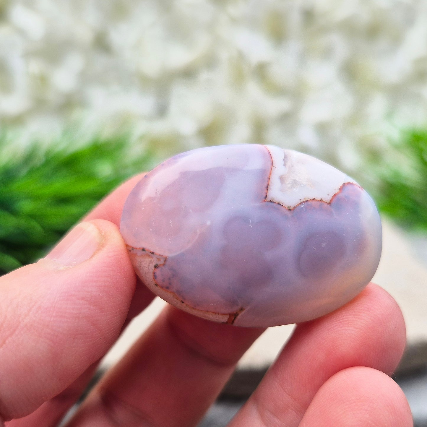 This Moroccan Agate palm stone has been polished and shaped to fit comfortably in the hand, making it perfect for daily use.