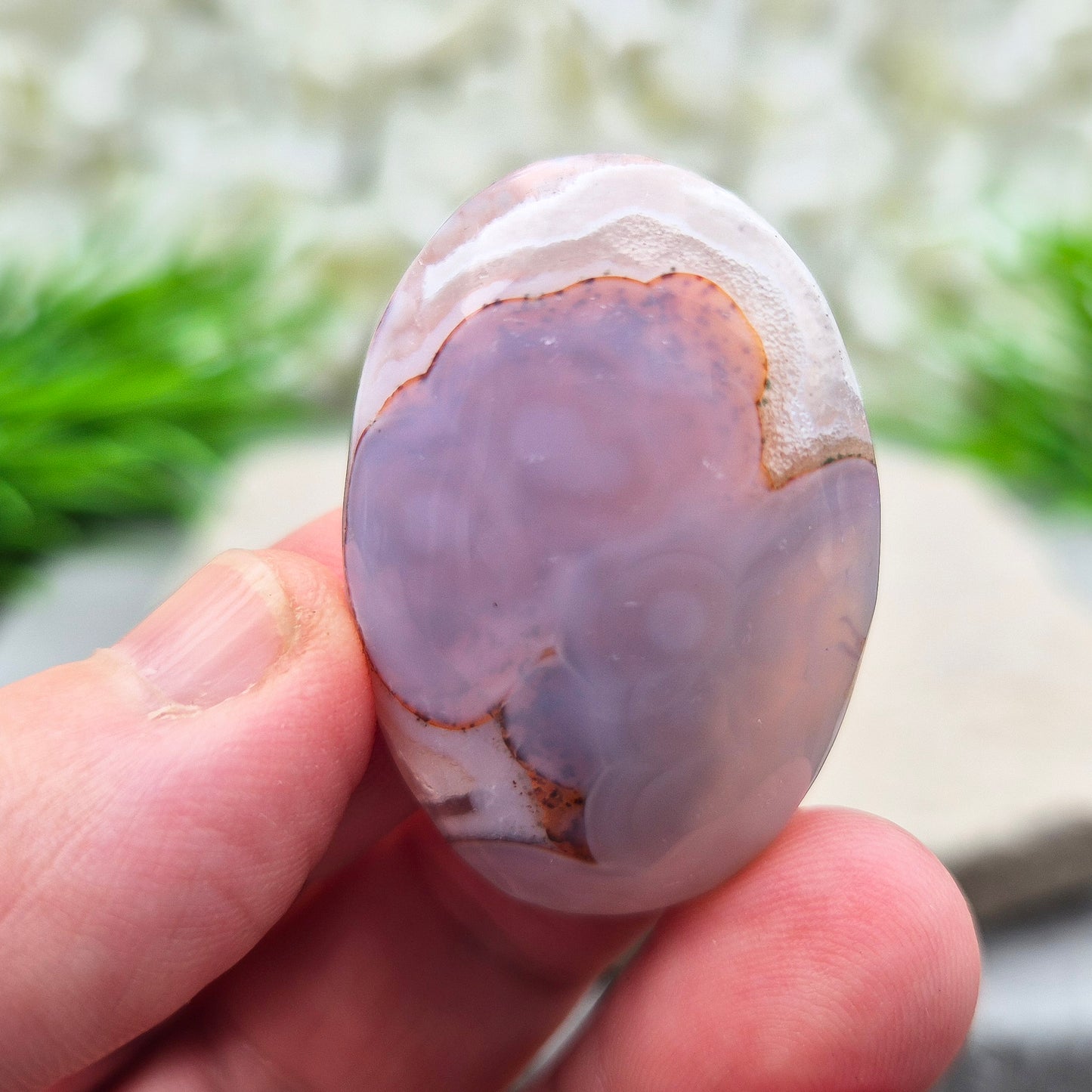 This Moroccan Agate palm stone has been polished and shaped to fit comfortably in the hand, making it perfect for daily use.
