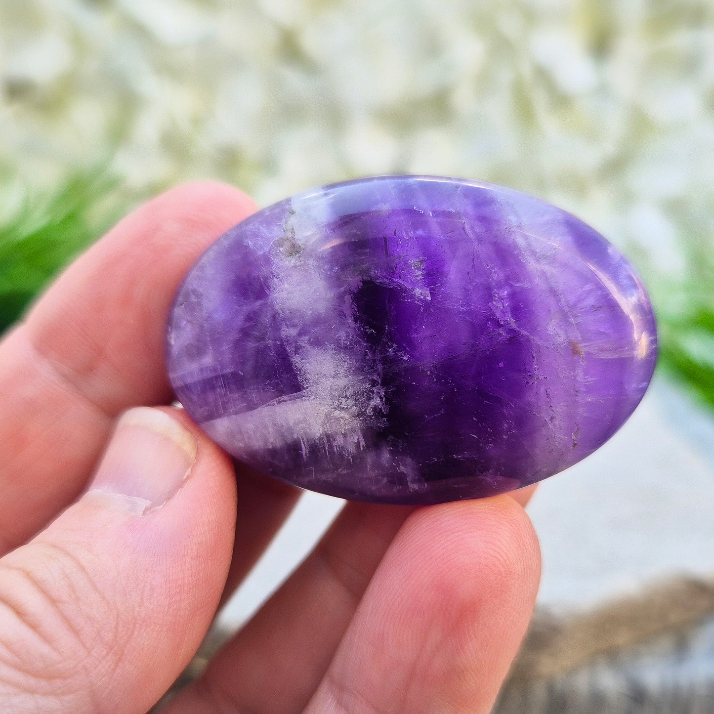 Polished Chevron Amethyst palm stone. Blends Amethyst and Quartz energy for cleansing, calm, courage, and spiritual awareness.