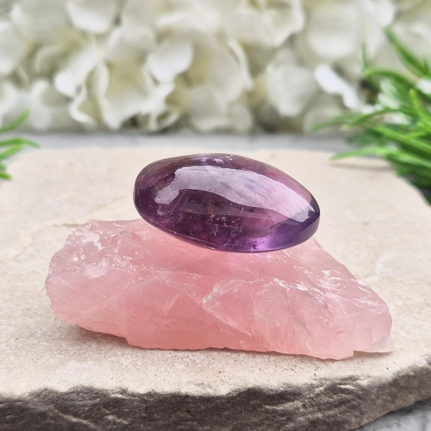 This Rose Quartz platform from South Africa is a versatile piece, with one side left natural and the other cut flat. Its flat surface makes it ideal for displaying your favourite crystals, jewellery, or small treasures
