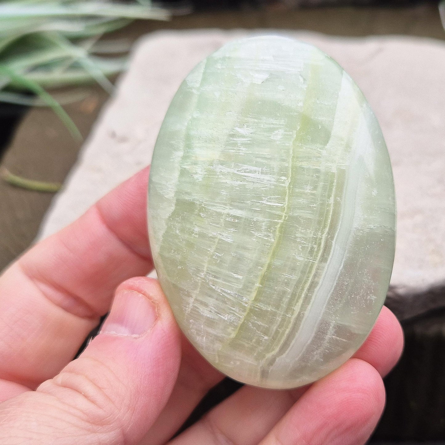 Pistachio Green Calcite palm stone soothes, restores balance, and encourages renewal. Perfect for meditation, emotional healing, and fresh energy flow.