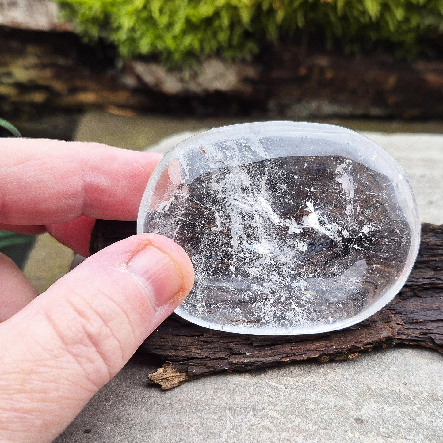 Quartz Crystal Palm Stone – A smooth, soothing stone that promotes clarity, calm, and positive energy, perfect for meditation or daily use.