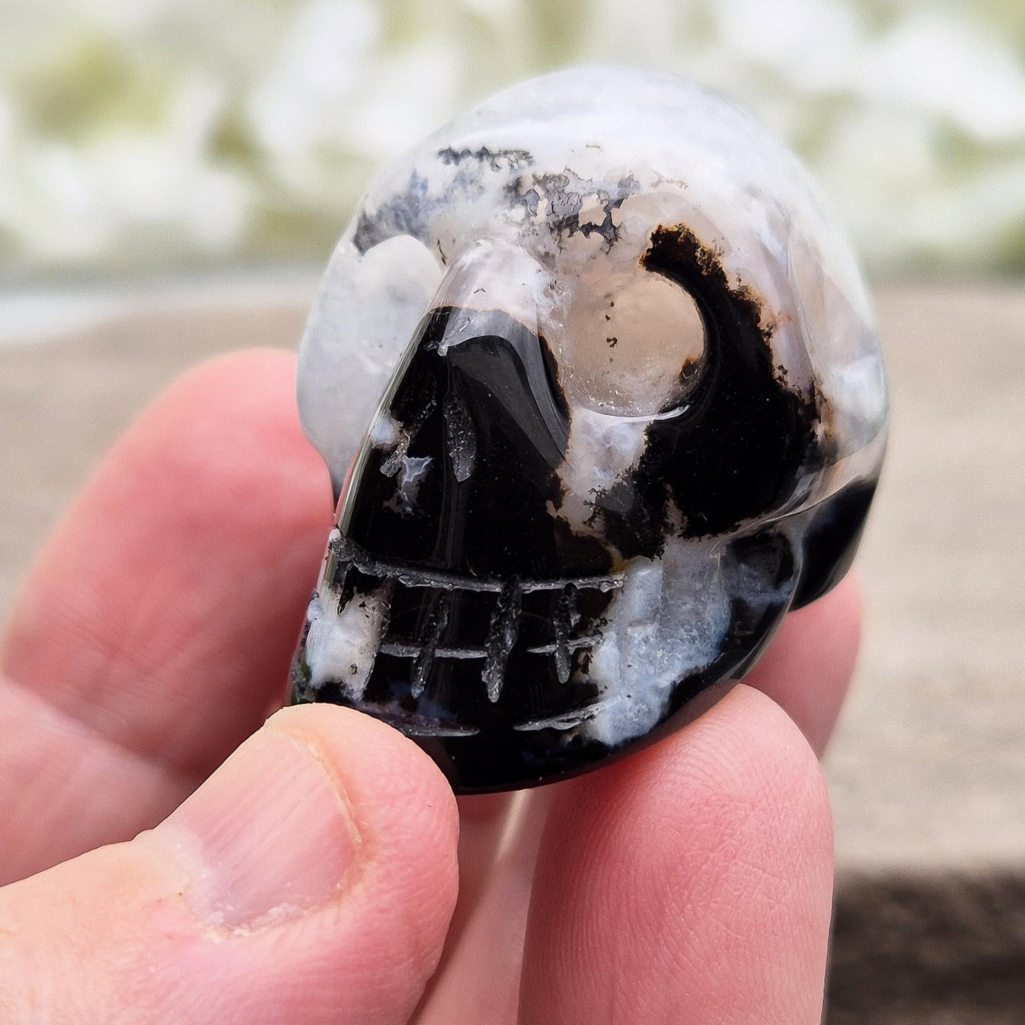 Polished Sardonyx and Jasper crystal skull. Grounding stone for strength, focus and stability. Supports resilience, balance and clear thinking.
