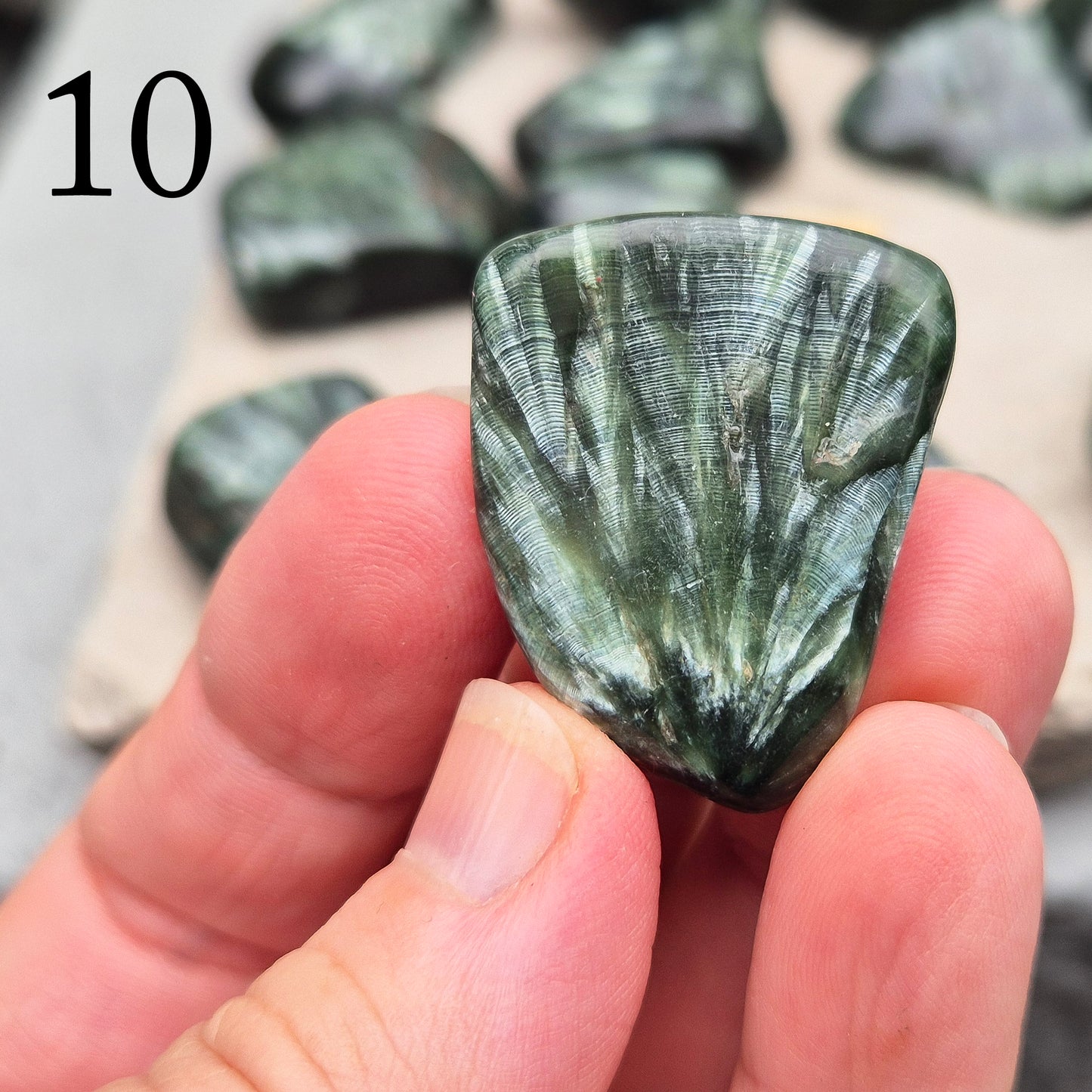 AAA Grade Seraphinite from Siberia, known as the Angel Stone, connects with angelic energy, opens the heart, and supports spiritual awakening.