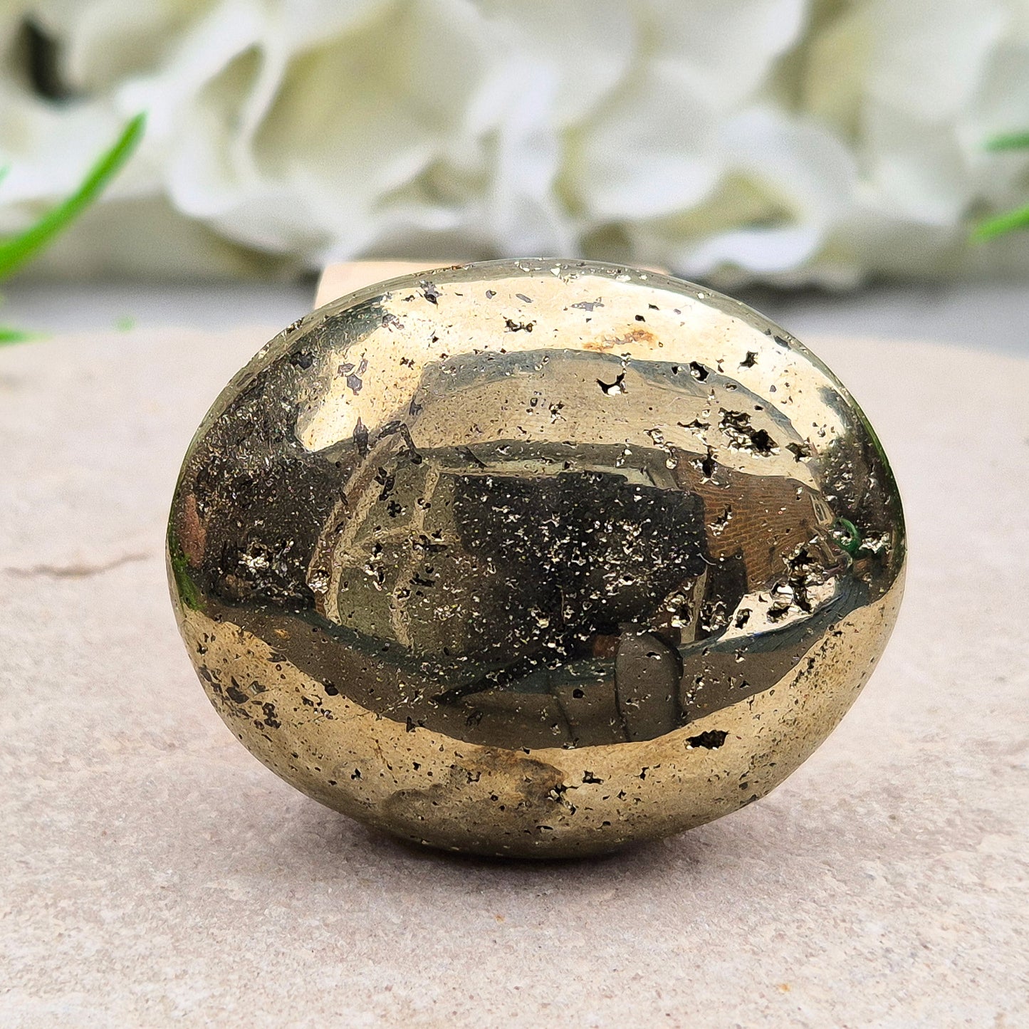 Sparkling Pyrite palmstone from Brazil. A crystal of protection, confidence, and focus—ideal for creativity, insight, and shielding from negativity.