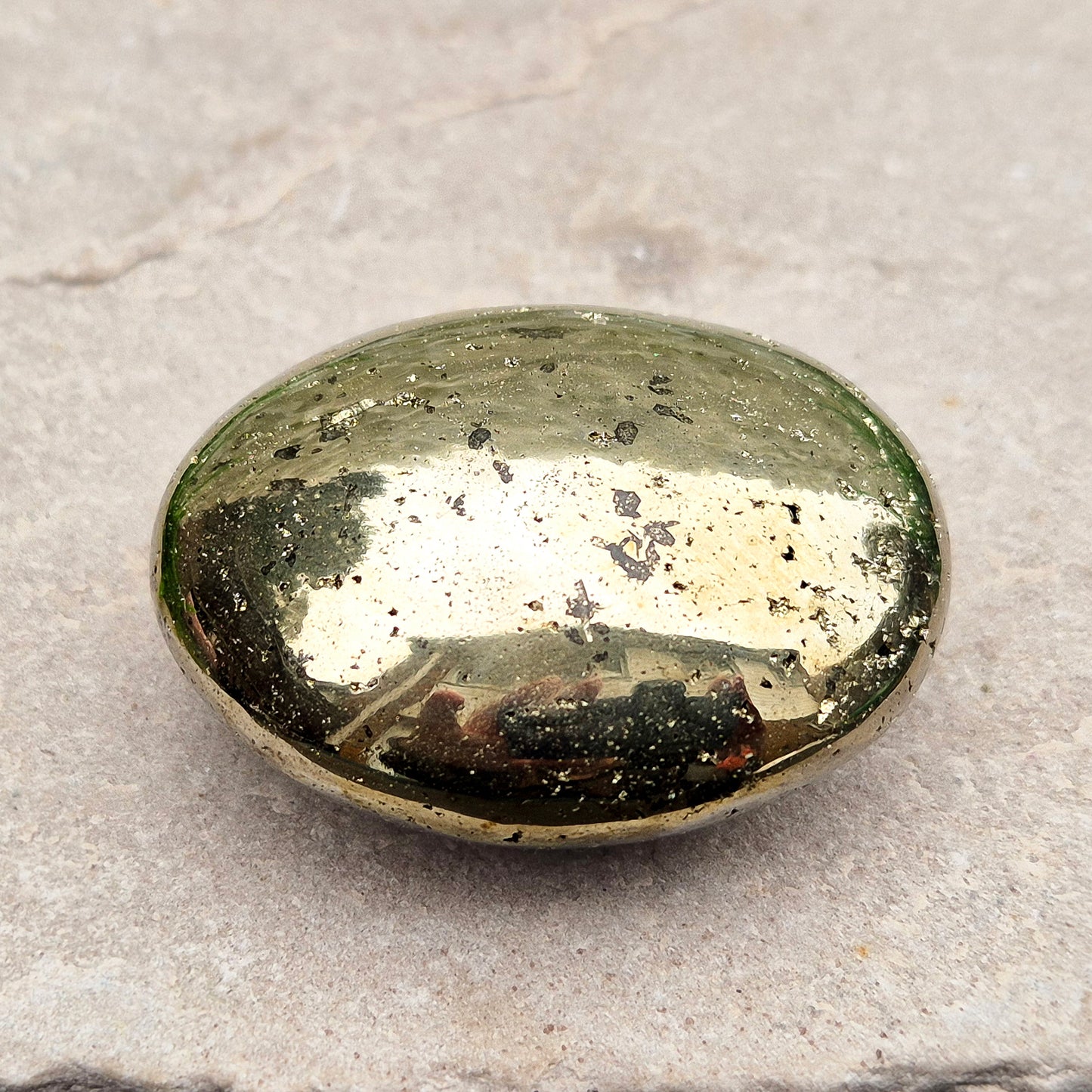 Sparkling Pyrite palmstone from Brazil. A crystal of protection, confidence, and focus—ideal for creativity, insight, and shielding from negativity.