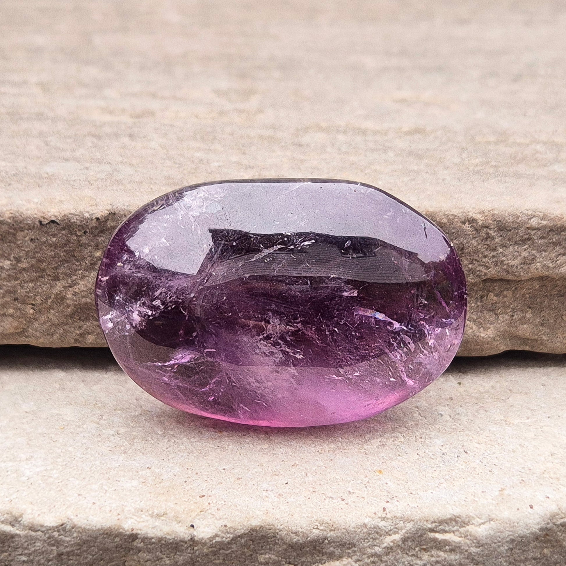 Amethyst Palm Stone with deep purple tones. A soothing crystal for balance, peaceful energy, and gentle spiritual connection.