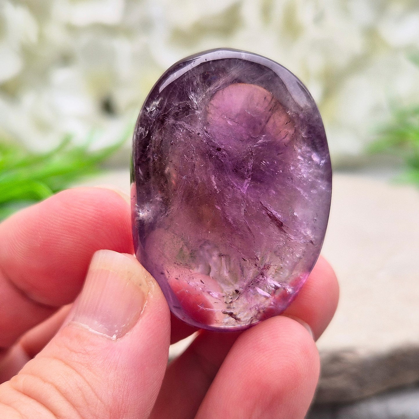 Amethyst Palm Stone with deep purple tones. A soothing crystal for balance, peaceful energy, and gentle spiritual connection.