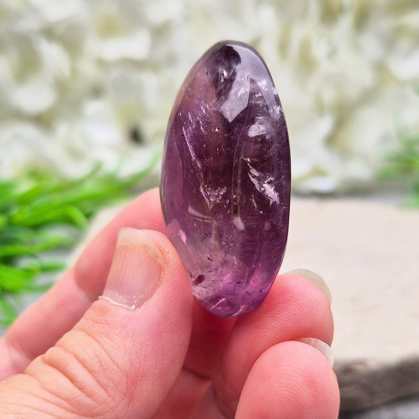 Amethyst Palm Stone with deep purple tones. A soothing crystal for balance, peaceful energy, and gentle spiritual connection.