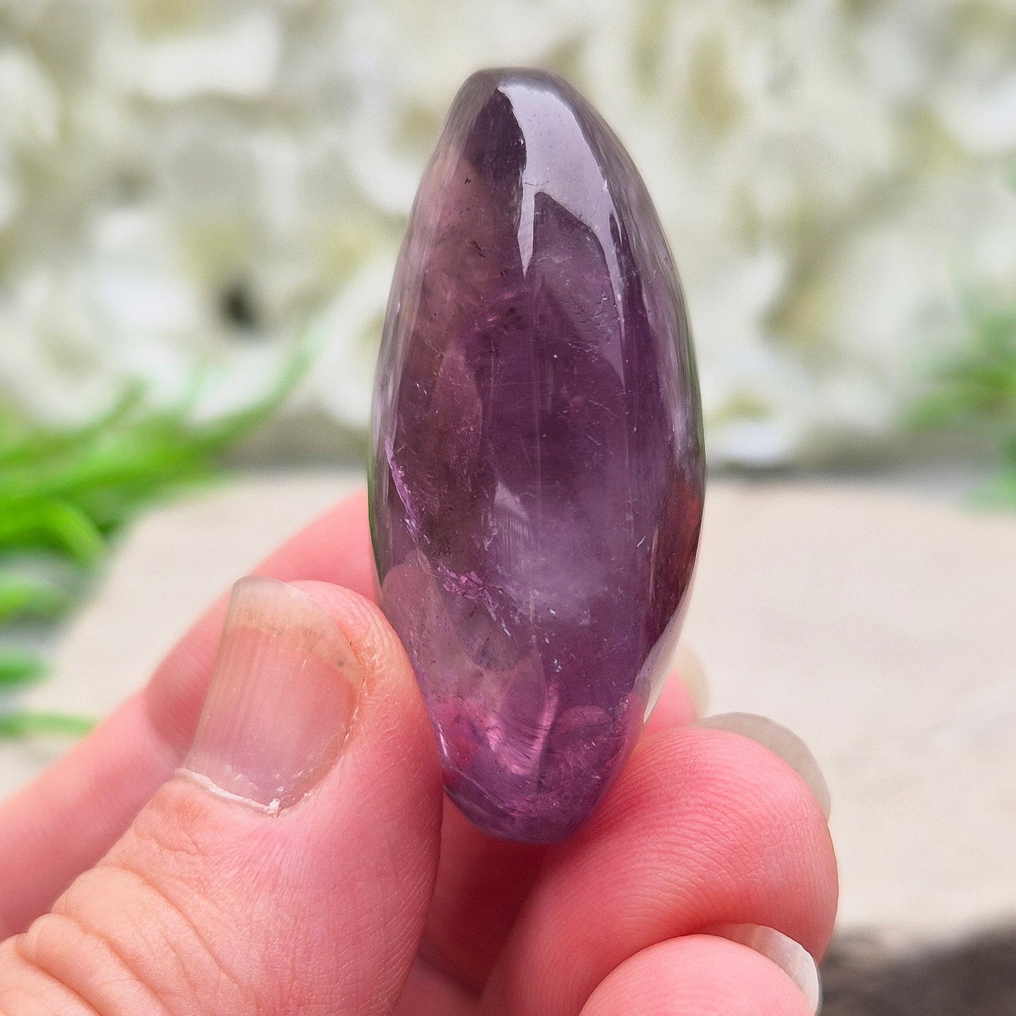 Amethyst Palm Stone with deep purple tones. A soothing crystal for balance, peaceful energy, and gentle spiritual connection.