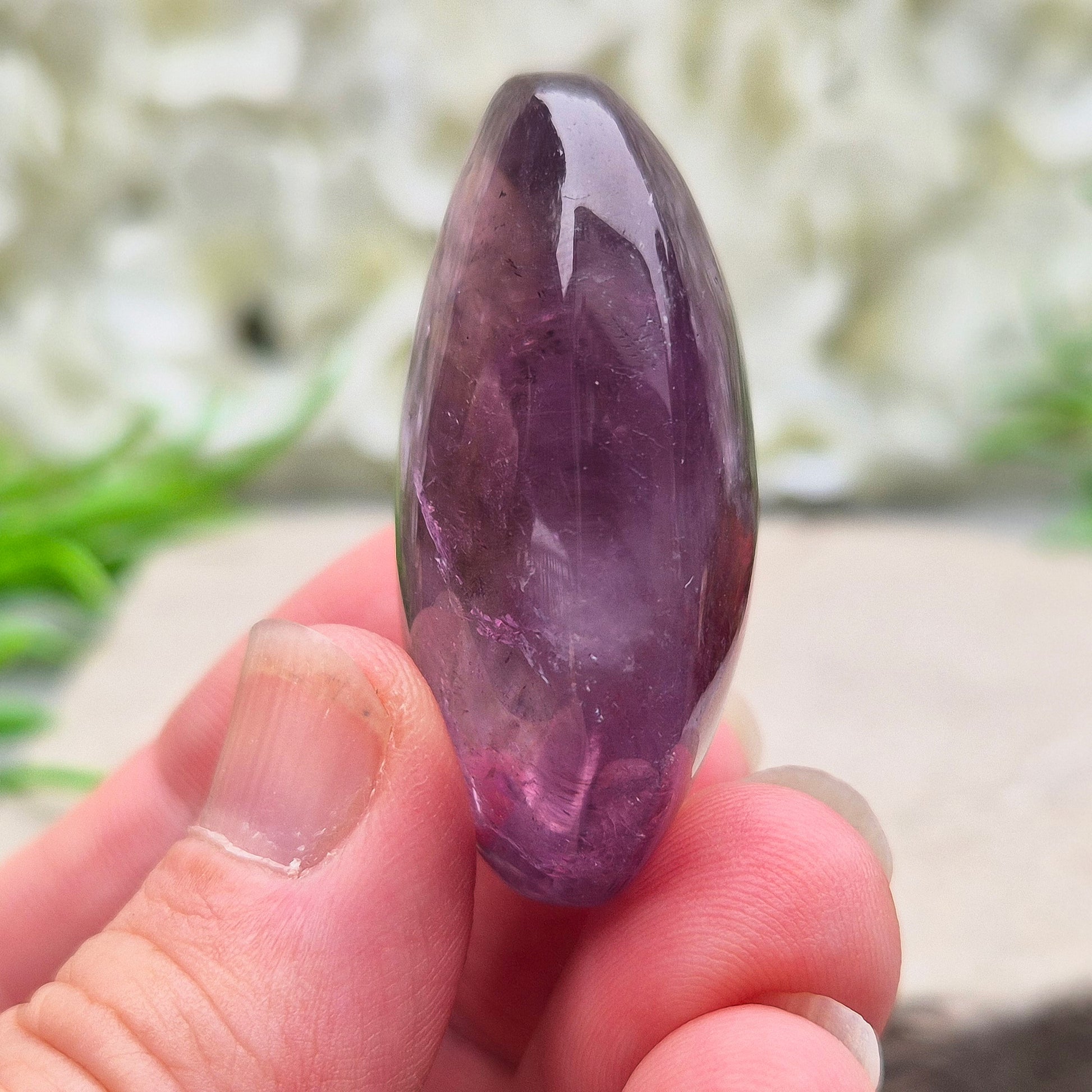 Amethyst Palm Stone with deep purple tones. A soothing crystal for balance, peaceful energy, and gentle spiritual connection.