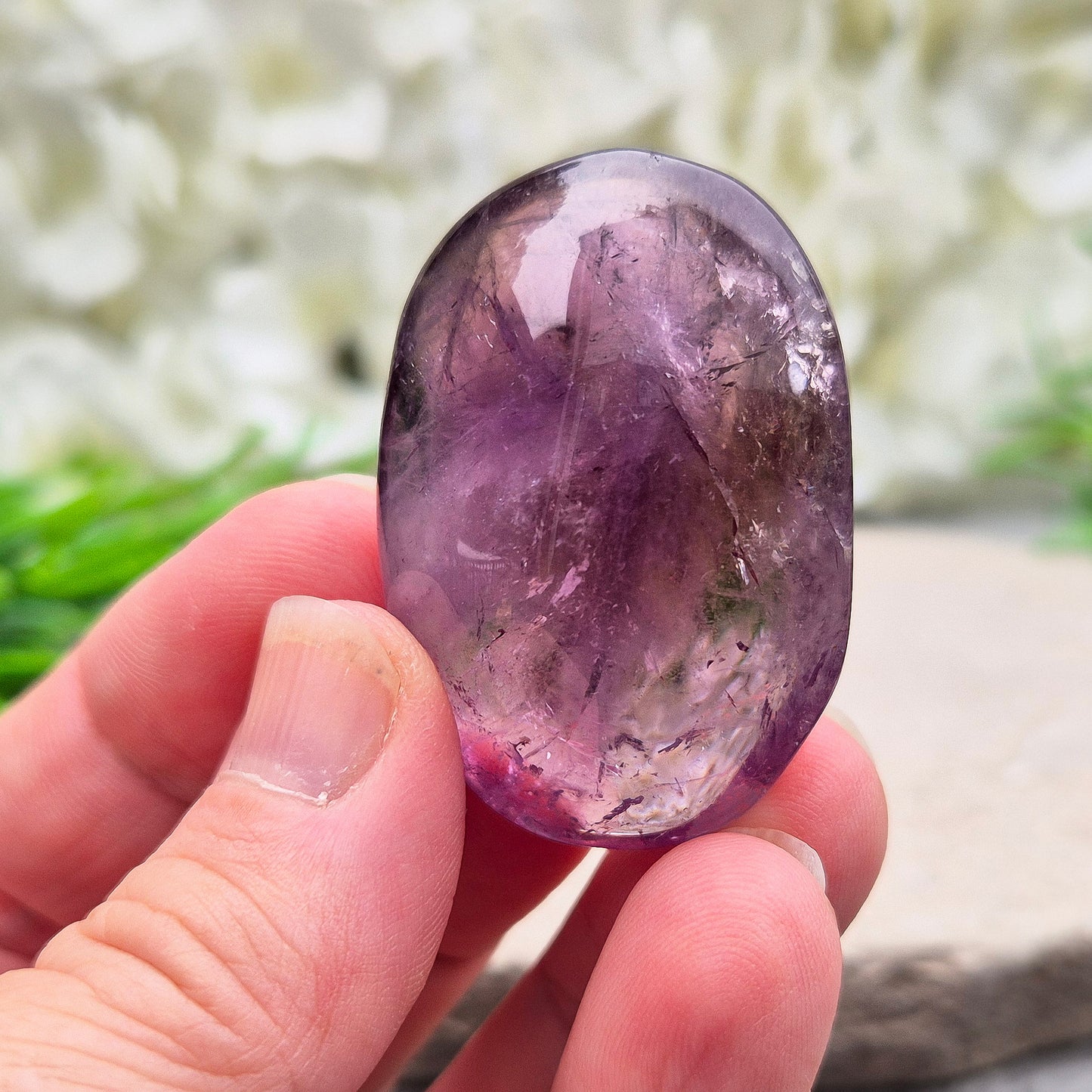 Amethyst Palm Stone with deep purple tones. A soothing crystal for balance, peaceful energy, and gentle spiritual connection.