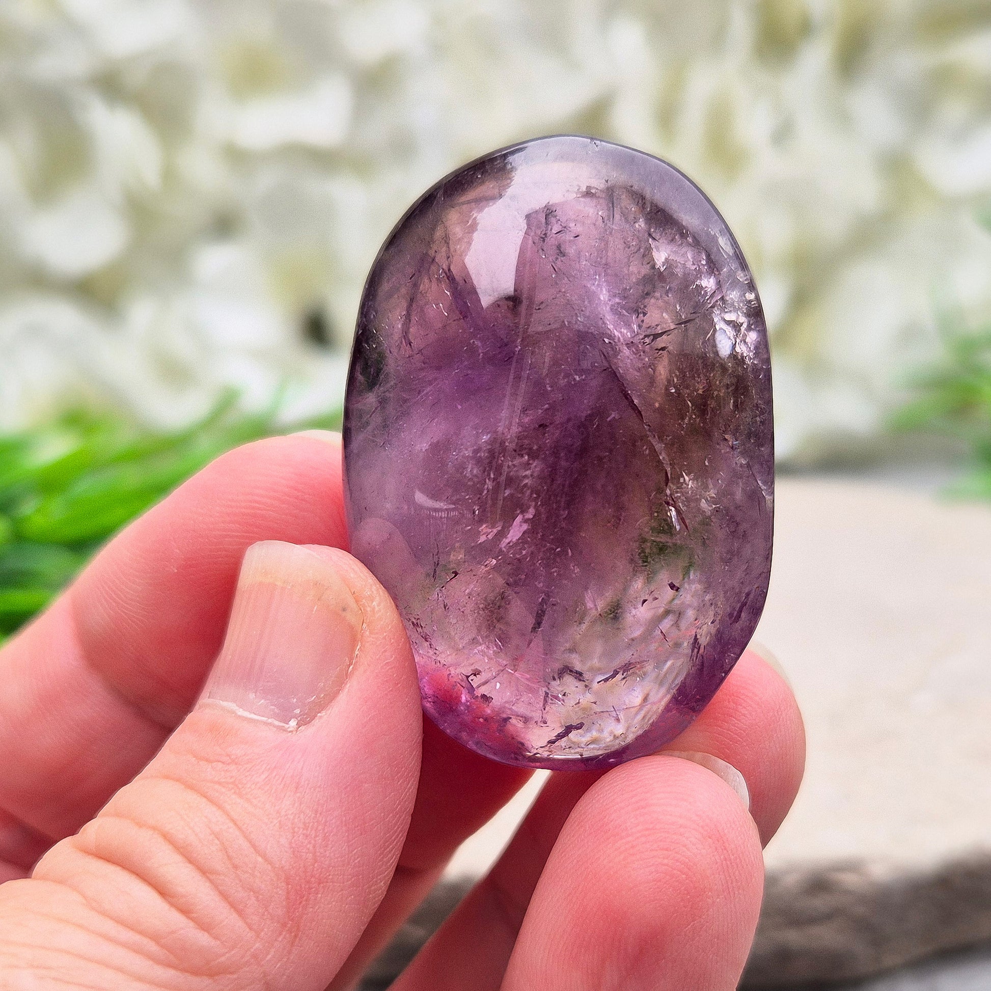 Amethyst Palm Stone with deep purple tones. A soothing crystal for balance, peaceful energy, and gentle spiritual connection.