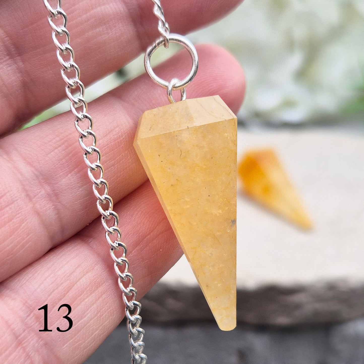 Golden Healer Quartz pendulum for energy work, dowsing, and intuitive guidance. Connects to gentle healing, balance, and spiritual growth.