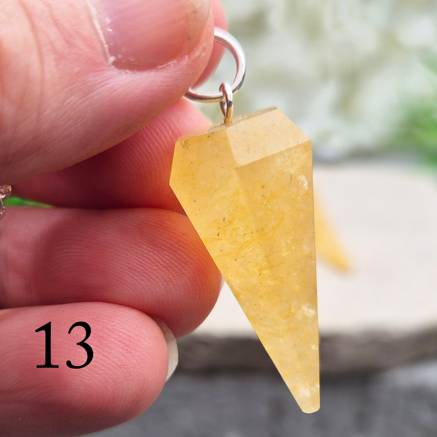 Golden Healer Quartz pendulum for energy work, dowsing, and intuitive guidance. Connects to gentle healing, balance, and spiritual growth.