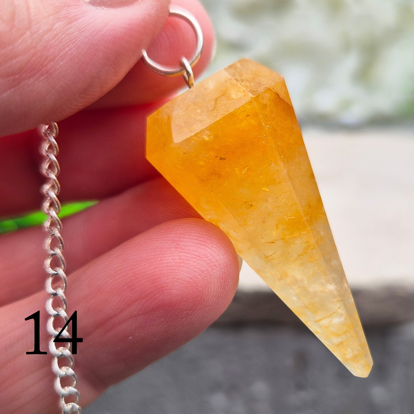 Golden Healer Quartz pendulum for energy work, dowsing, and intuitive guidance. Connects to gentle healing, balance, and spiritual growth.