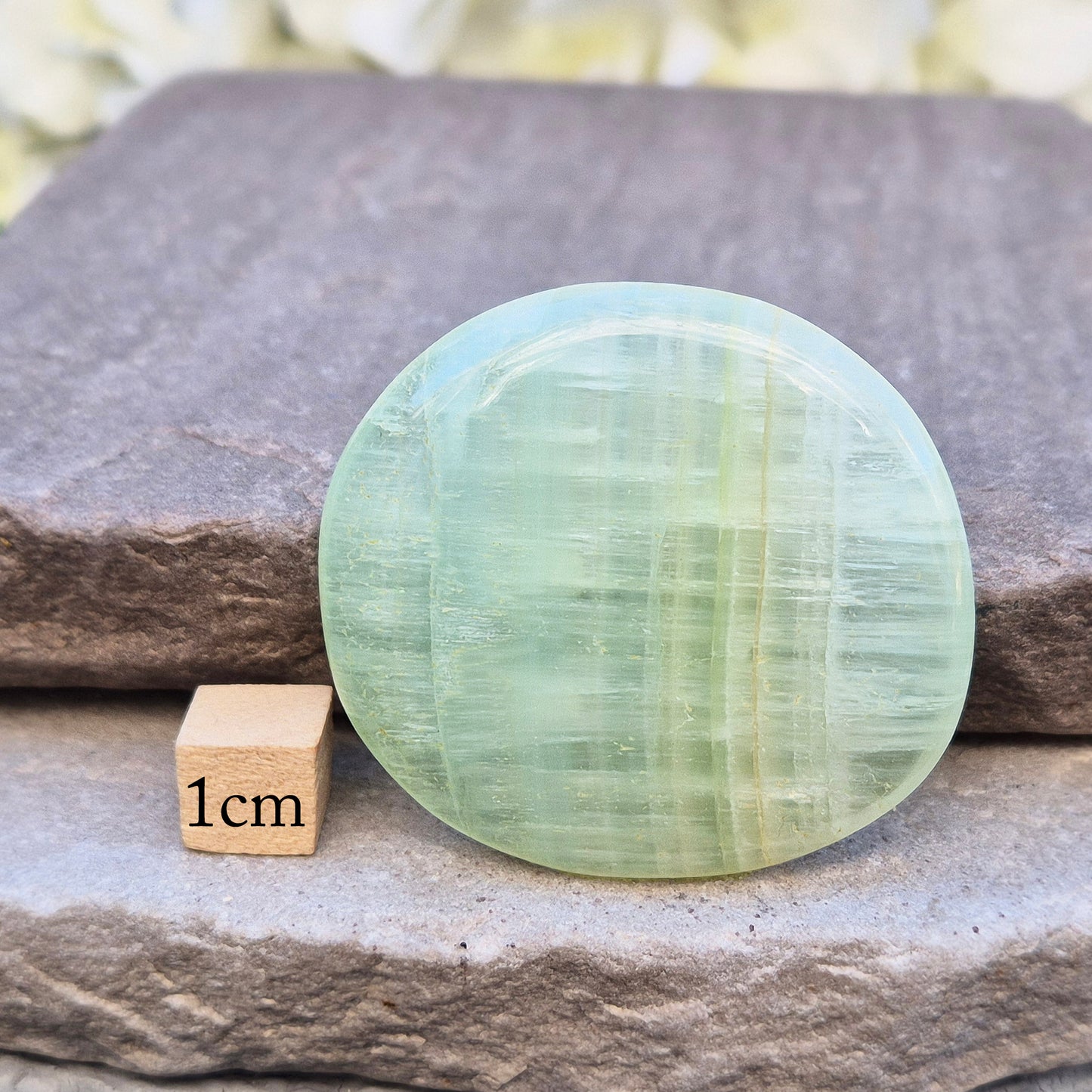 Pistachio Calcite palm stone from Pakistan with soft green tones. A calming crystal for emotional balance, stress relief, and gentle heart-led energy.