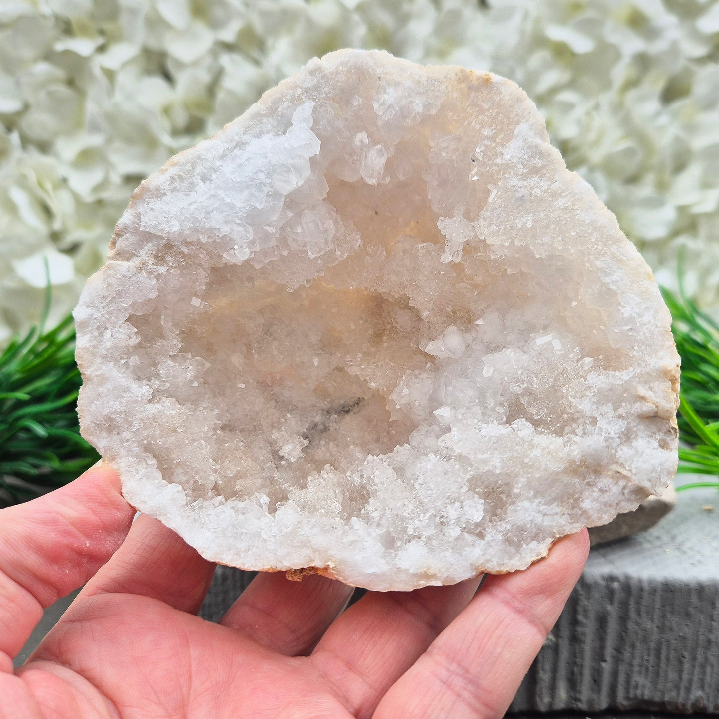 Decorative Quartz crystal geode pair with bright white points and natural cave formation. Ideal for meditation spaces, home décor, and crystal collections.