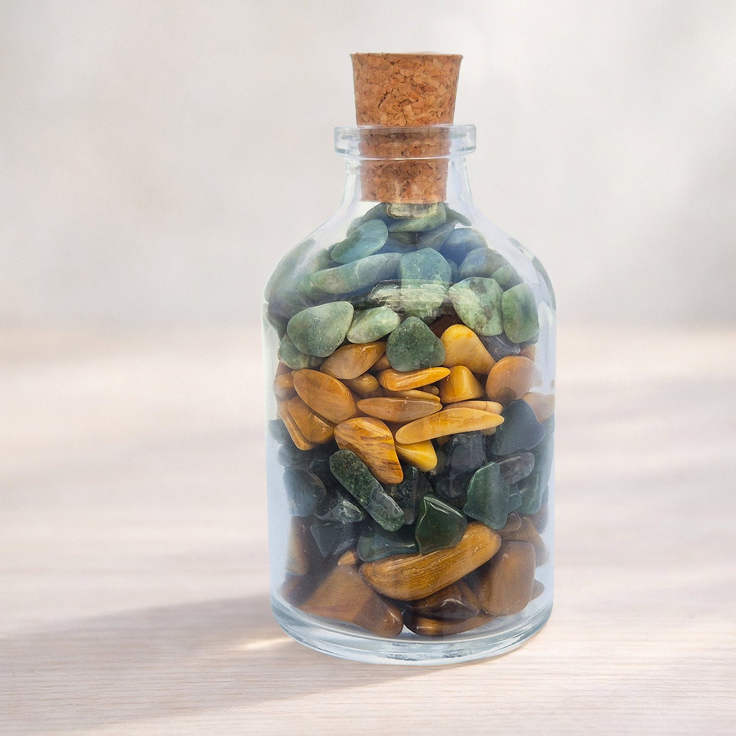 Inner Balance crystal bottle with jade, tiger eye, moss agate and jasper. A grounding decorative blend for calm focus, steady confidence and thoughtful gifting.