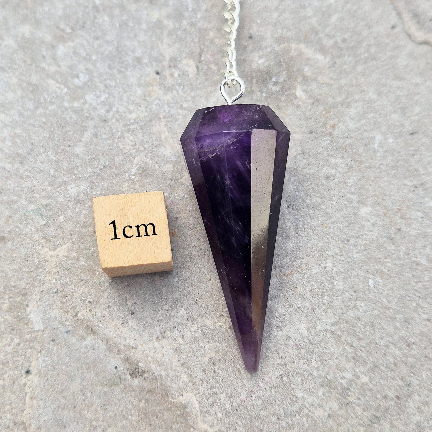 Dark Amethyst pendulum with rich natural colour, ideal for dowsing, divination, and energy work. A beautiful tool for spiritual practice, tarot readings, and crystal healing.