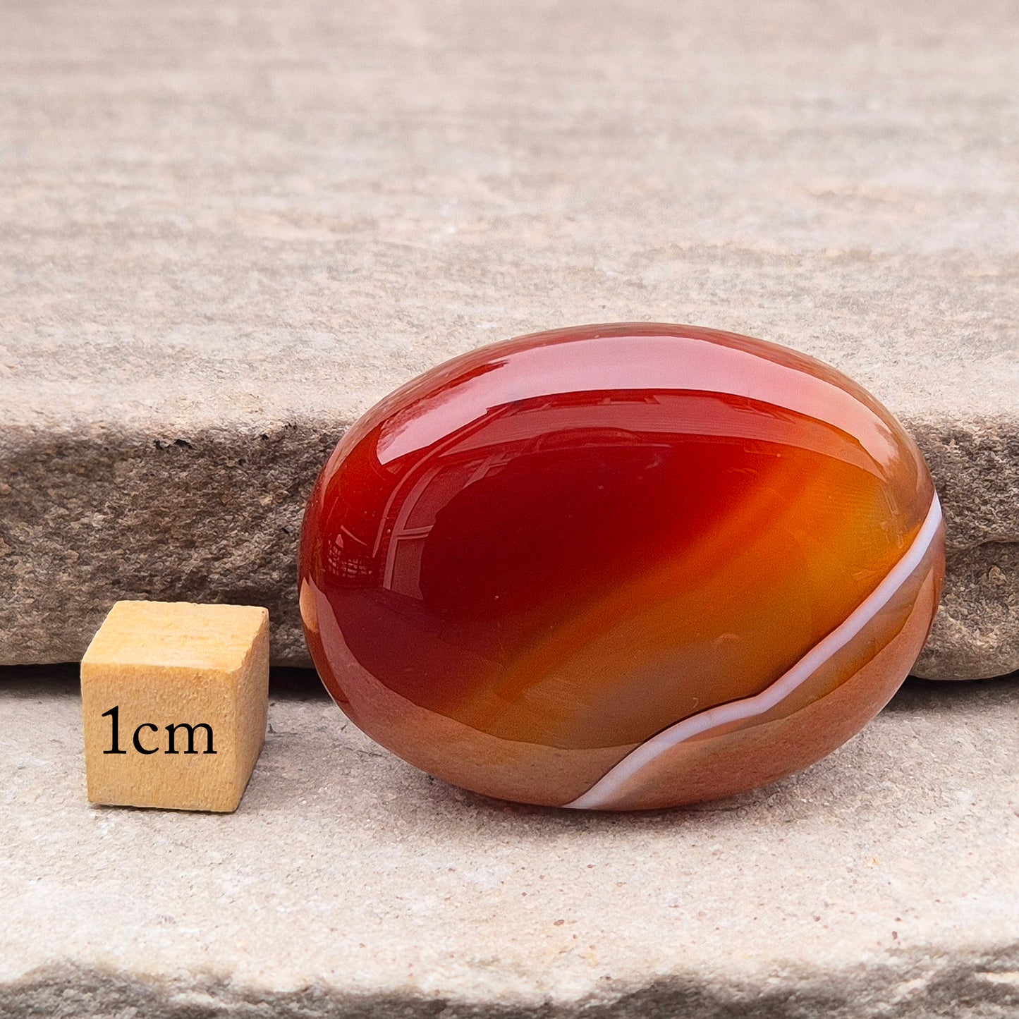 Banded Carnelian palm stone from Madagascar. Boosts motivation, confidence and creativity. Grounding Root and Sacral crystal for energy and focus.