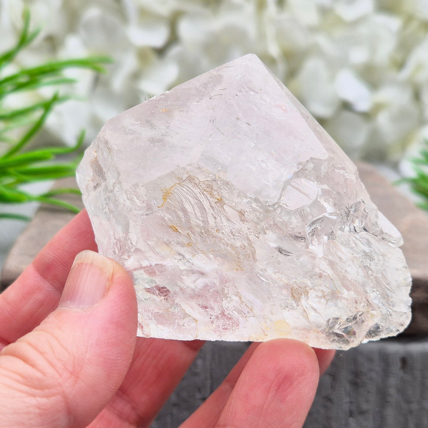 Quartz Crystal Standing Point. Point is polished at tip with a rainbow, sides are natural and the base is cut flat so it will sit on an even surface.