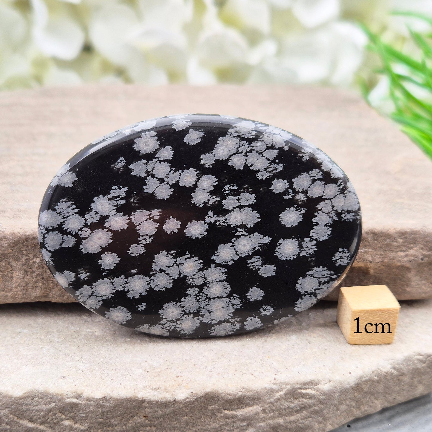 Natural Snowflake Obsidian Palm Stone – protective grounding crystal for releasing old patterns, emotional balance, and calm daily support.