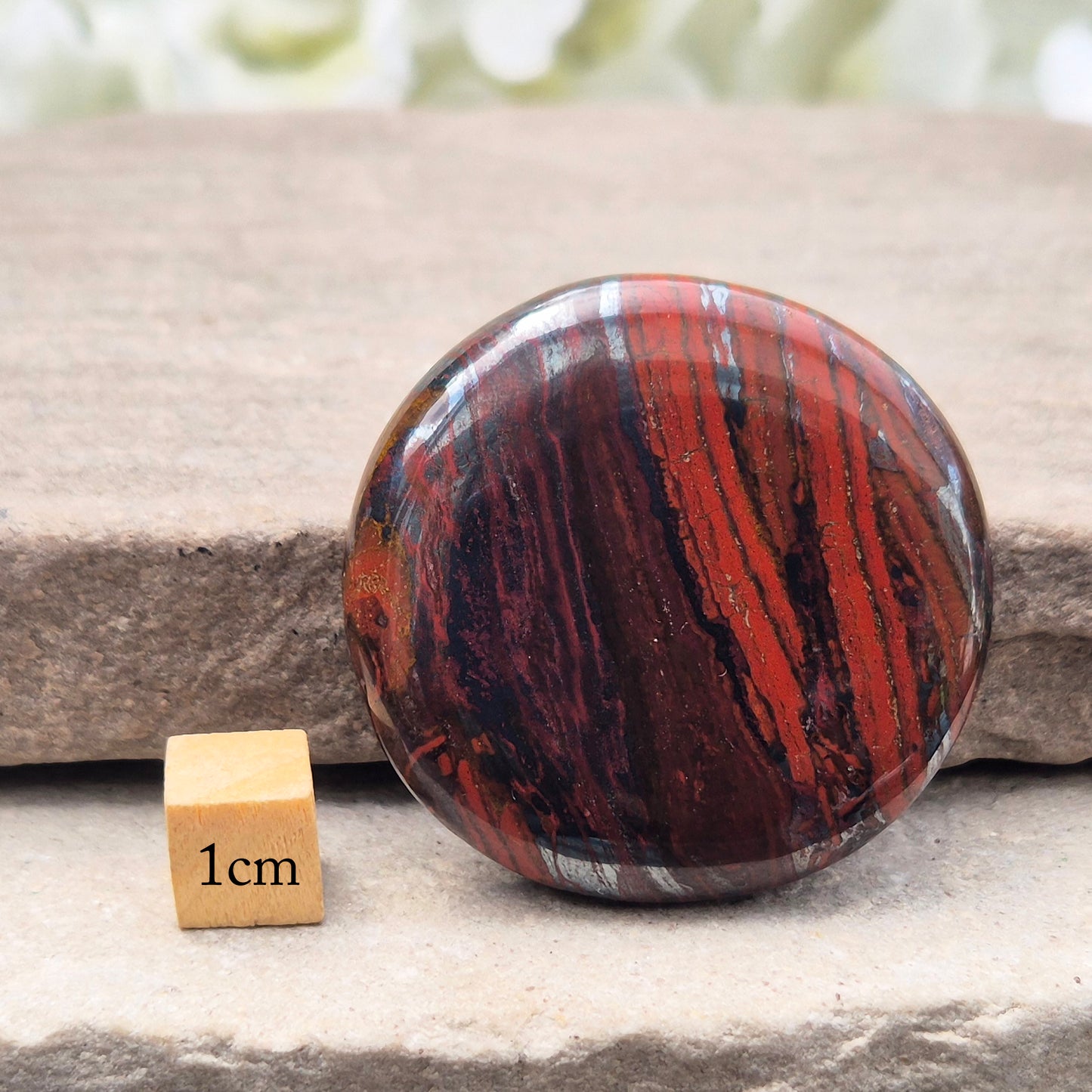 Composite Mugglestone palm stone combining Tiger Eye, Hematite & Red Jasper. Grounding, protective energy supporting focus, strength, and balance.