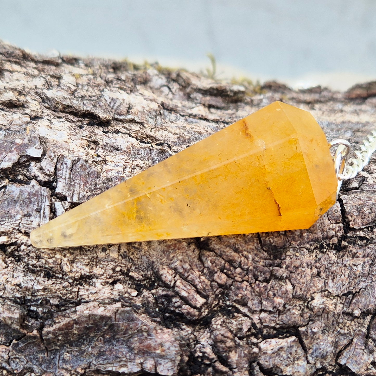 Golden Healer Quartz pendulum for dowsing and energy work. Supports clarity, balance, healing, and connection to higher guidance.