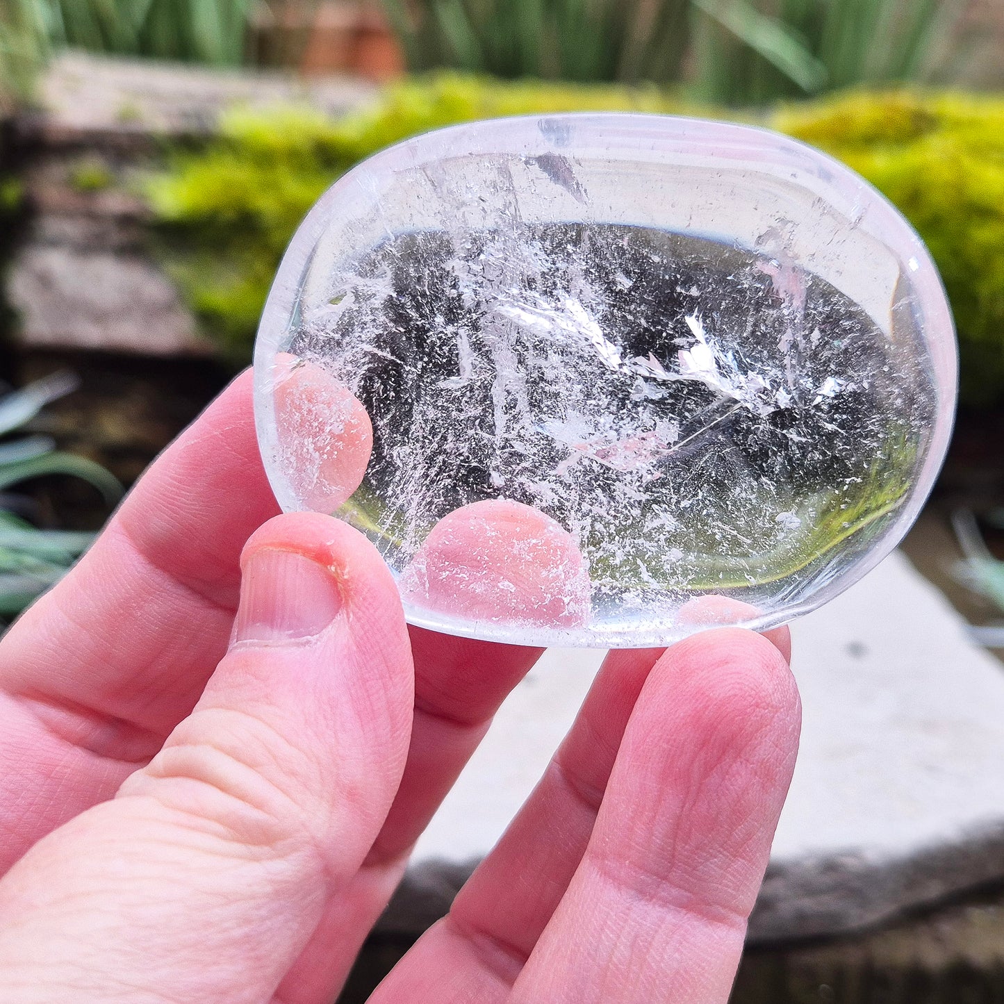Quartz Crystal Palm Stone – A smooth, soothing stone that promotes clarity, calm, and positive energy, perfect for meditation or daily use.