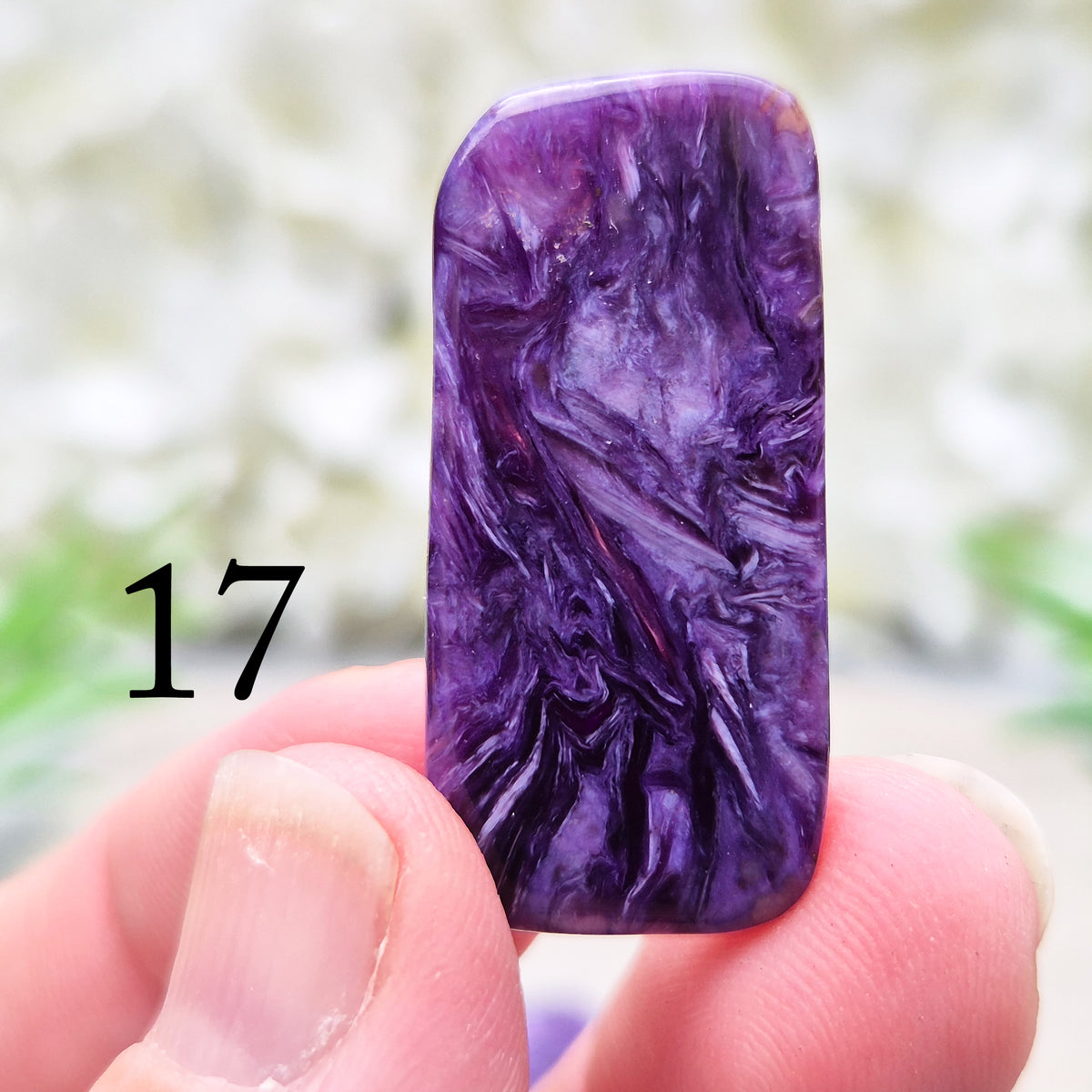Polished Charoite slice with rich purple swirling patterns. A striking crystal associated with transformation, emotional strength, and personal growth.