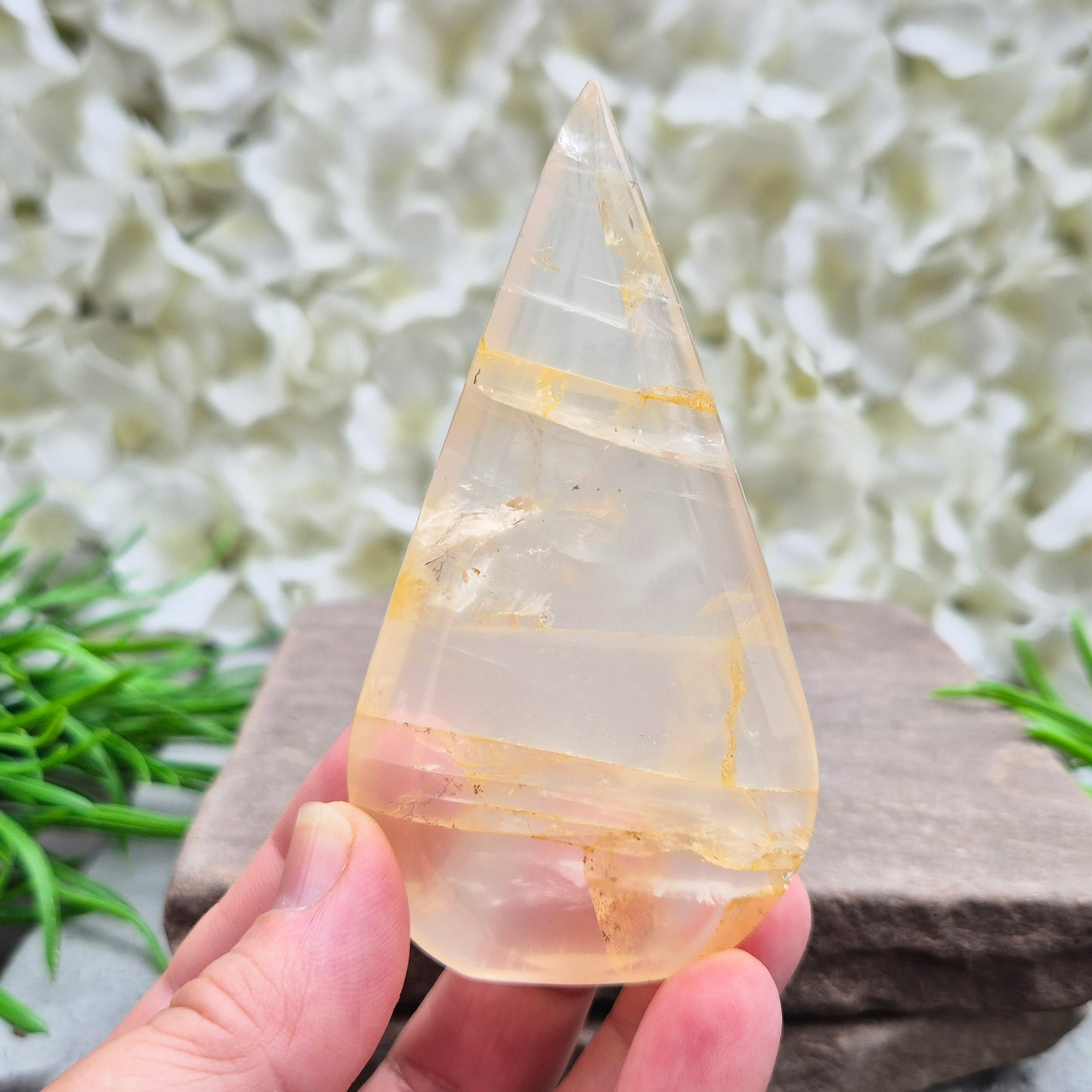 Golden Healer Quartz Teardrop – polished self-standing crystal with golden hematoid inclusions. Brazilian quartz for meditation, altars & spiritual guidance.