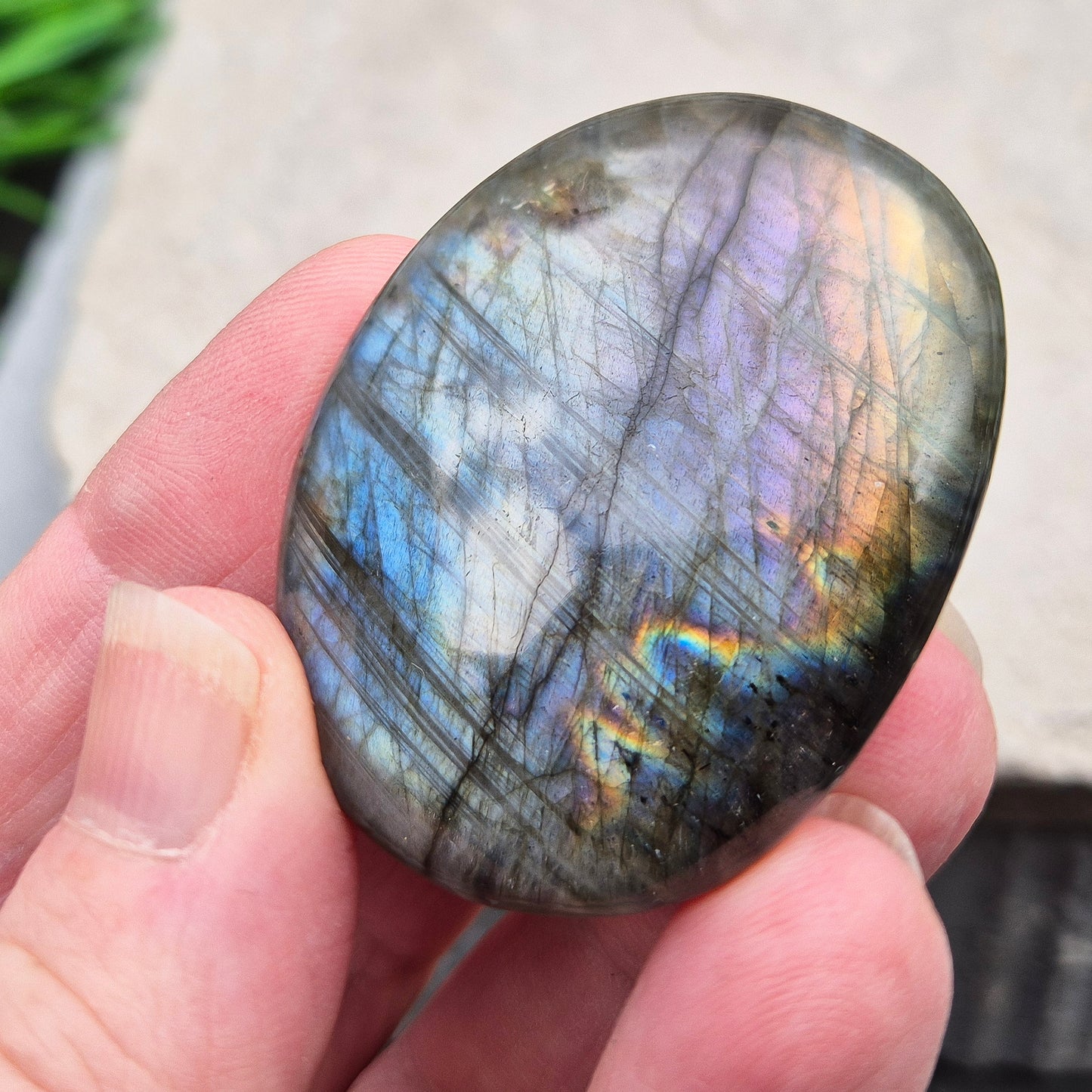 Mystical Labradorite palm stone from Madagascar with vibrant flash. Supports intuition, aura protection & energy clearing. Pocket-sized crystal.